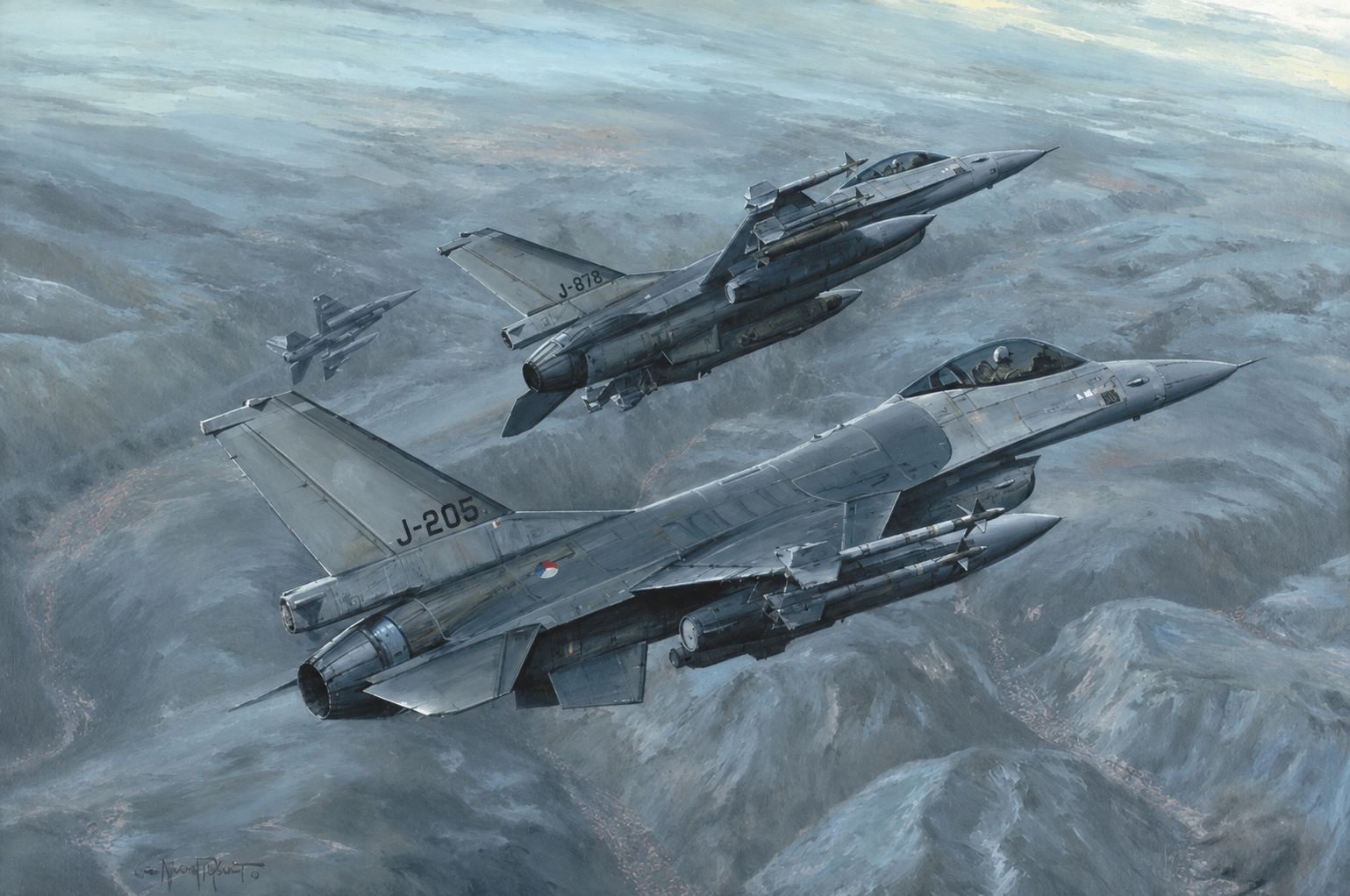 Three military fighter jets in formation over a rocky, cloud-filled sky.