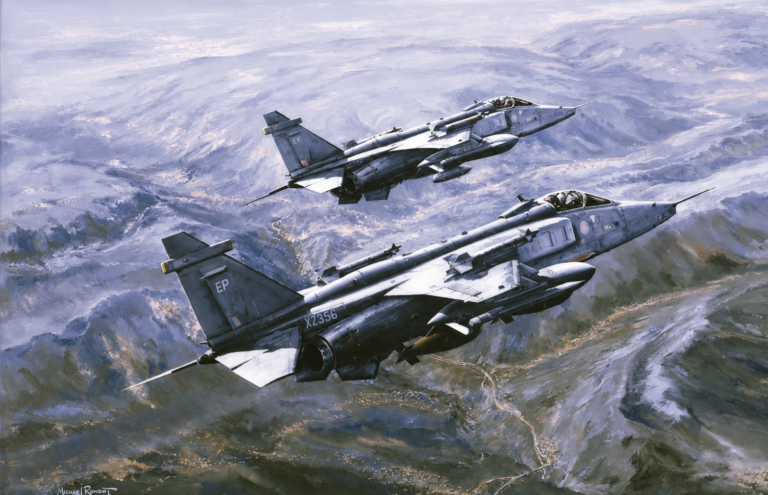 Three RAF Tornado jets flying in formation over a mountainous valley.
