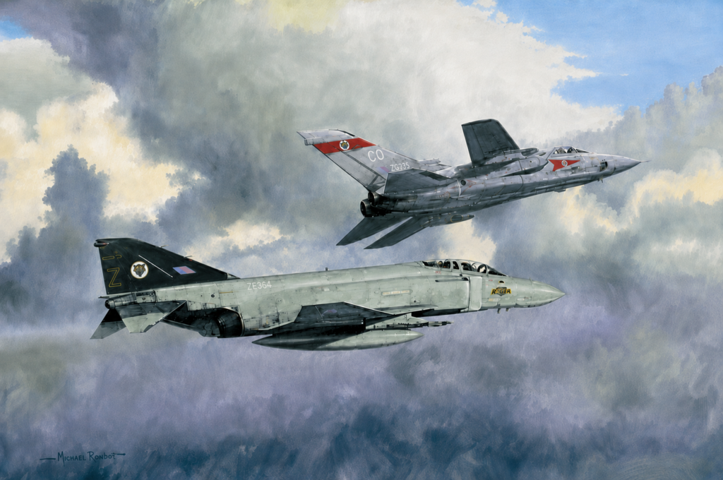 Two vintage military jets in formation flight through cloudy skies; a green-gray fuselage leads below while a silver jet passes overhead far right.