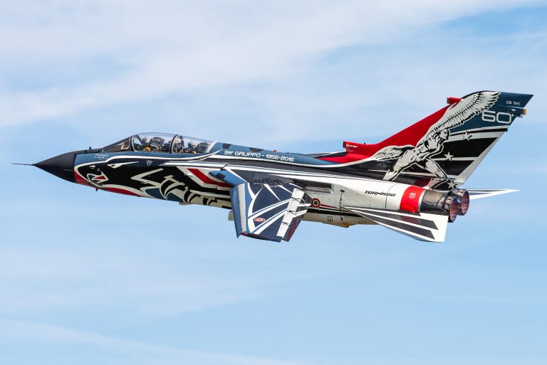 A high-resolution photograph by Kris Christiaens showing an Italian Air Force Panavia Tornado in 311º Gruppo Centenary special livery.