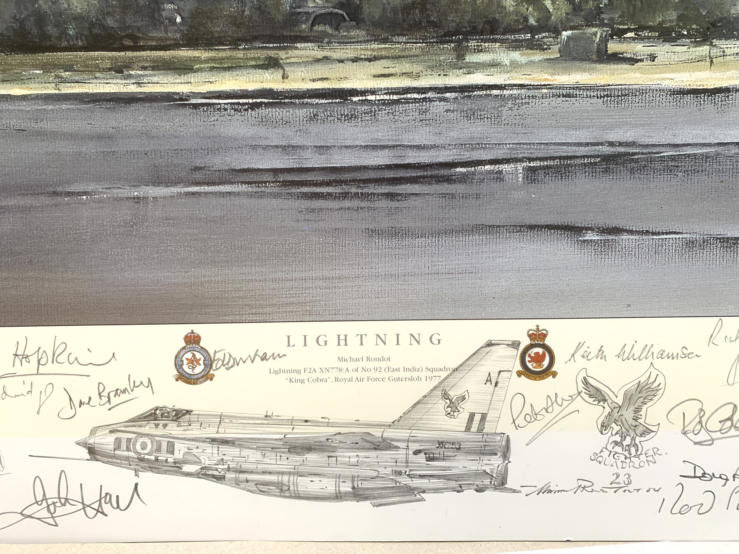 Illustration of a Lightning fighter jet drawing with many signatures and crests on a signed poster labeled LIGHTNING