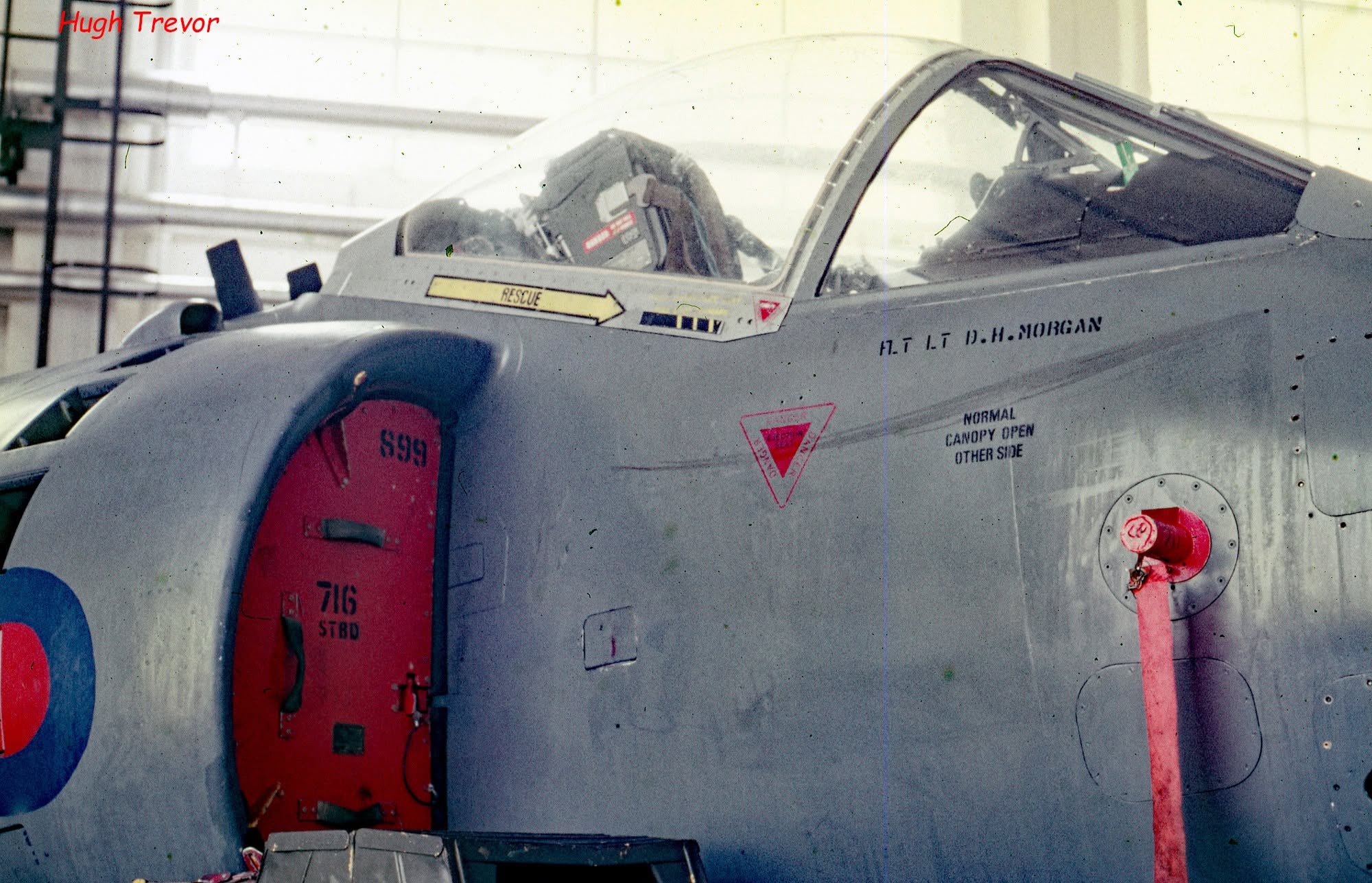 Close-up of the Sea Harrier cockpit and fuselage showing the pilot's name