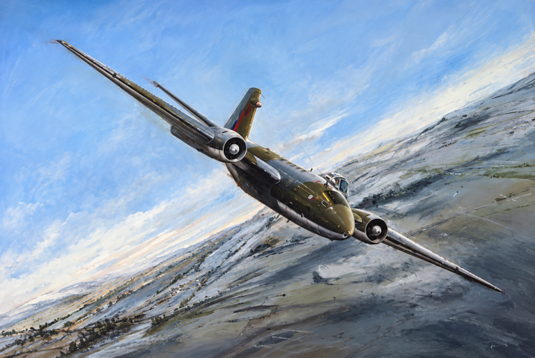 Twin-engine military aircraft in olive camouflage glides over snow-covered fields under a blue sky.