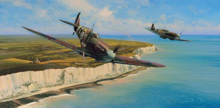 Two Spitfires flying low along a coastline above white cliffs and blue sea.