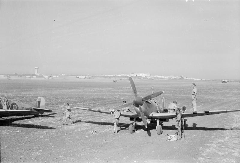 Ground crews working on No. 145 Squadron RAF Spitfire Mk IX aircraft at Pachino Sicily